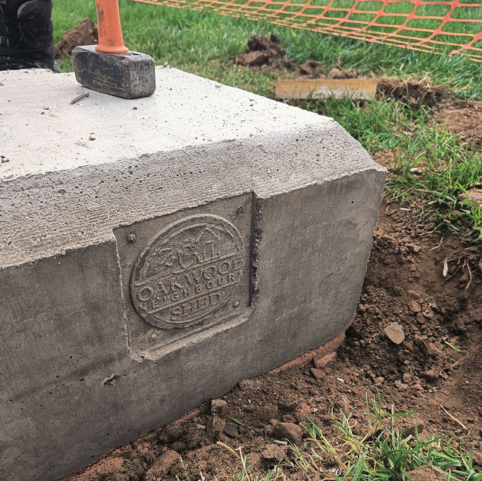 Conatiner plinth with our logo cast in concrete